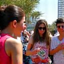 Group of young people engaging with public, handing out flyers
